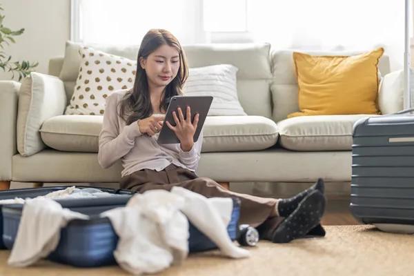 woman booking travel packing